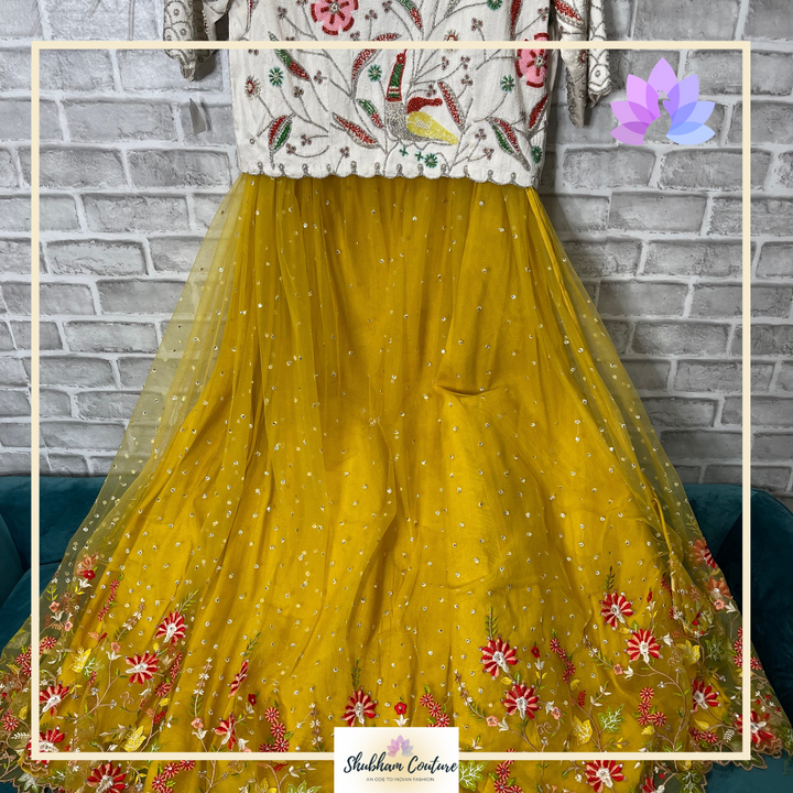 Yellow heavy net lehanga with designer white croptop with back zipper