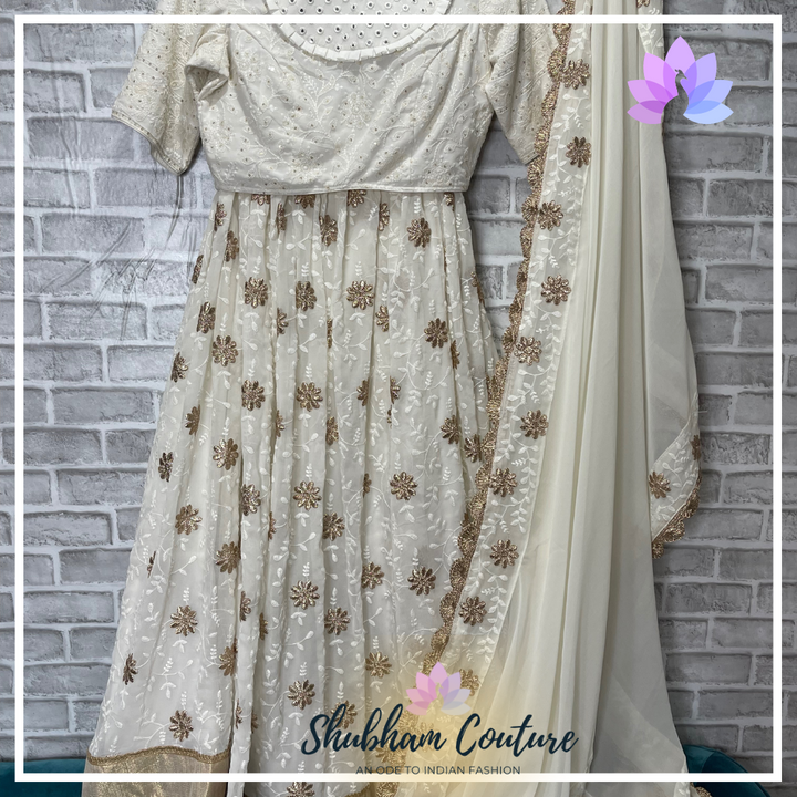 Elegant white threadwork and designer blouse lehanga