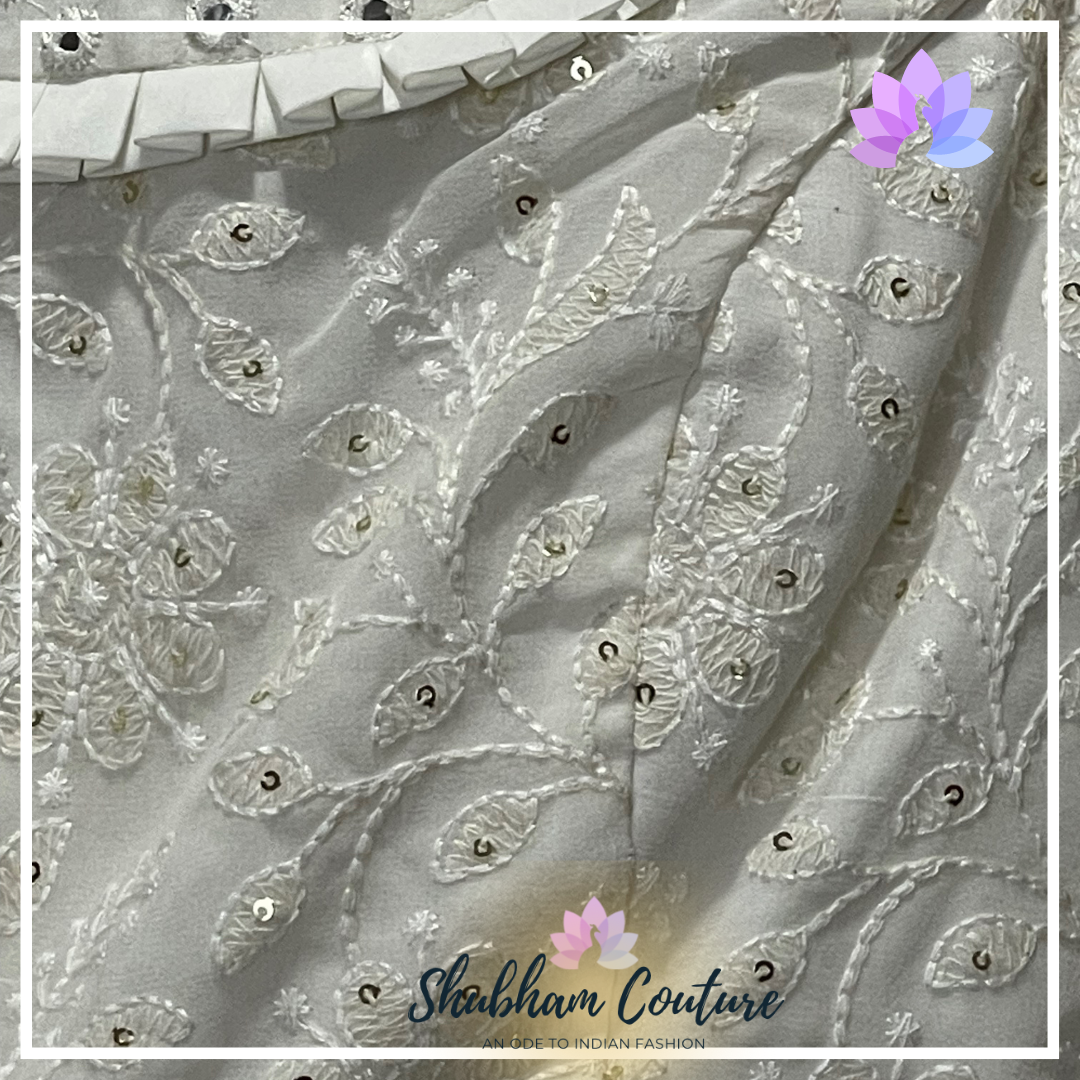 Elegant white threadwork and designer blouse lehanga