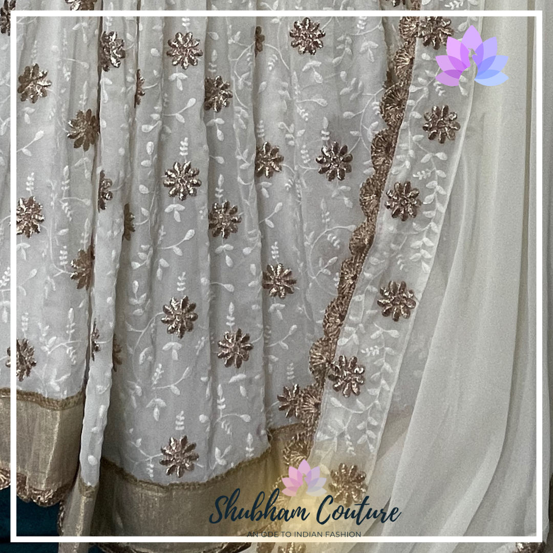 Elegant white threadwork and designer blouse lehanga