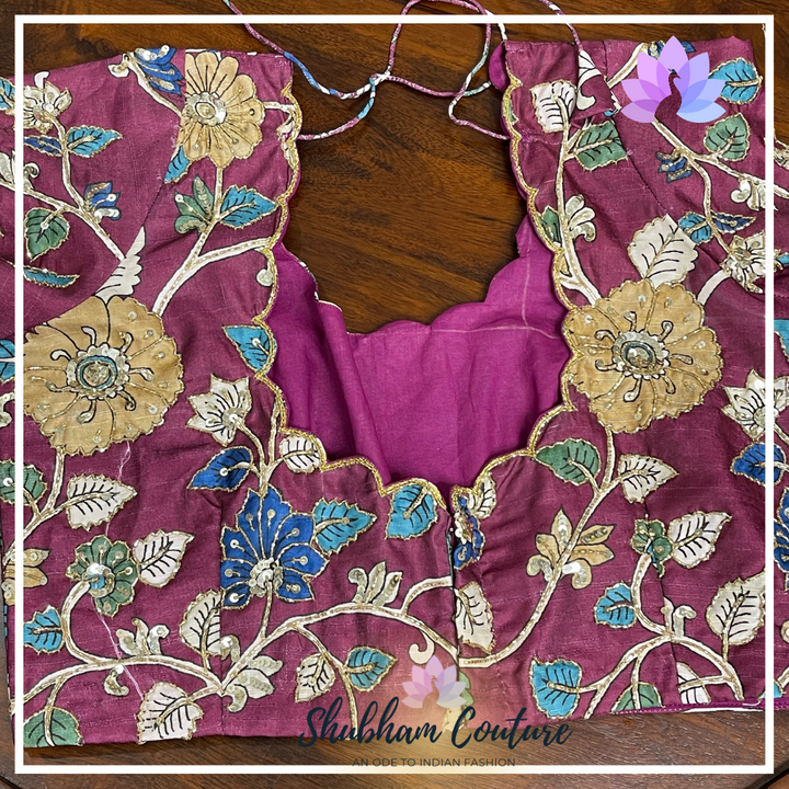 Floral grey organza saree with contrast kalamkari blouse in wine