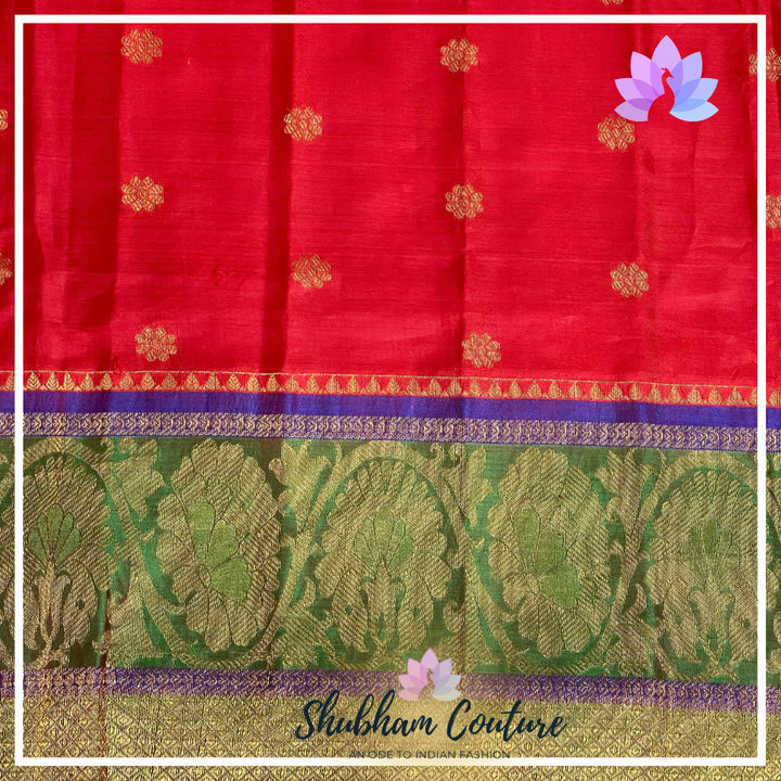 Bright red Kanchi silk saree with green contrast work blouse